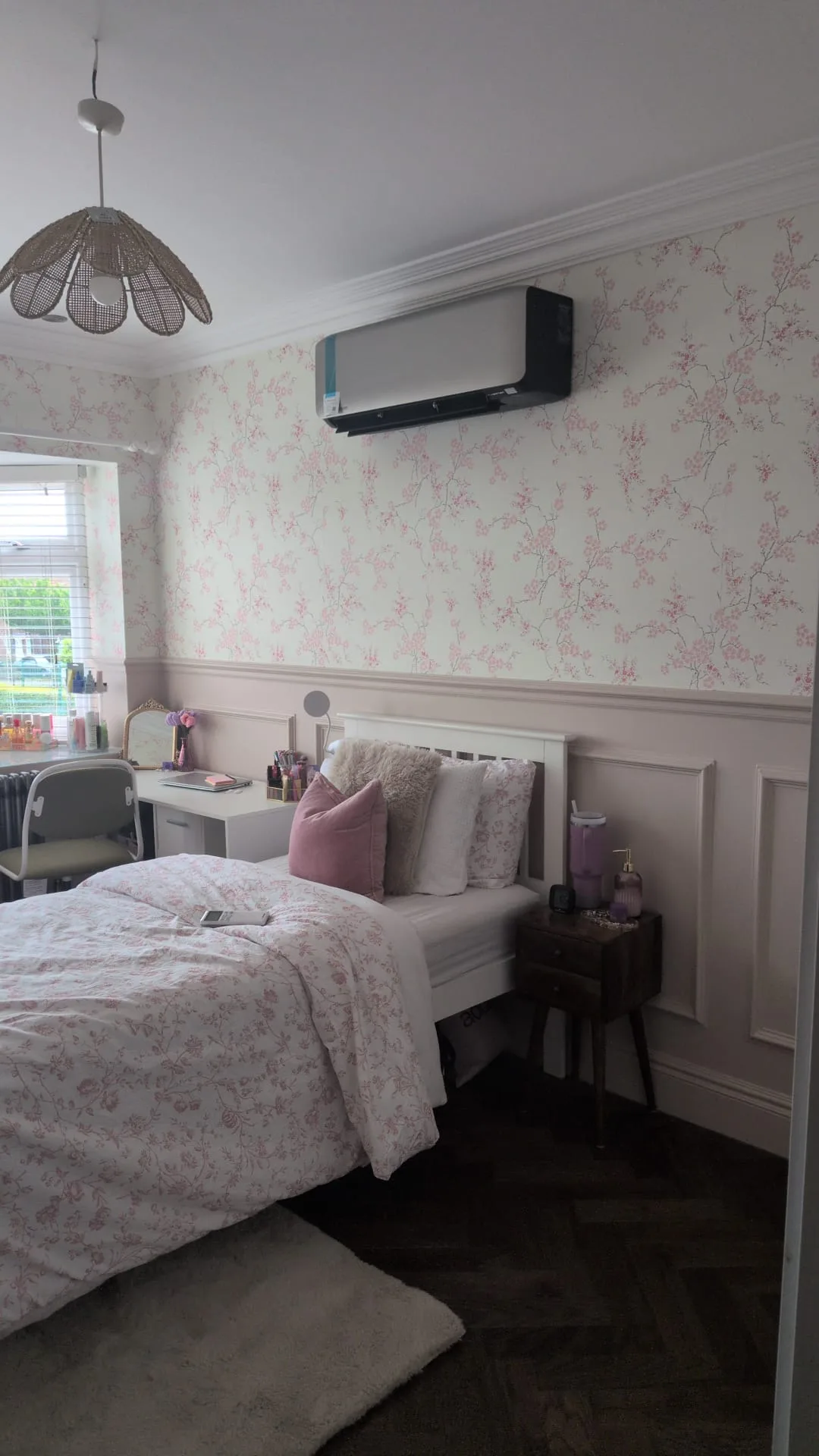 Wall-mounted split air conditioning unit installed in a London flat bedroom