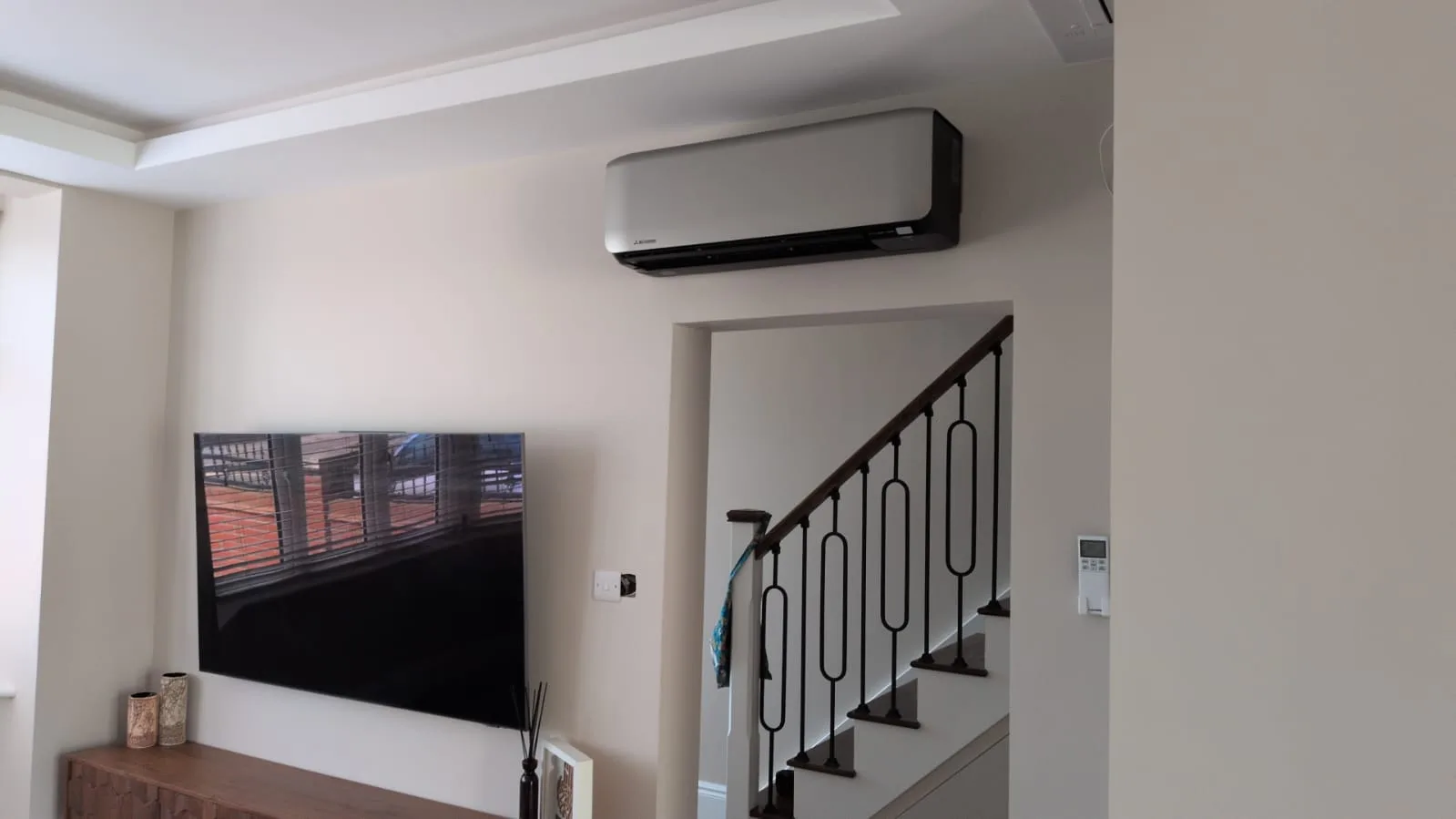 Mitsubishi wall-mounted air conditioning unit installed in a modern London home