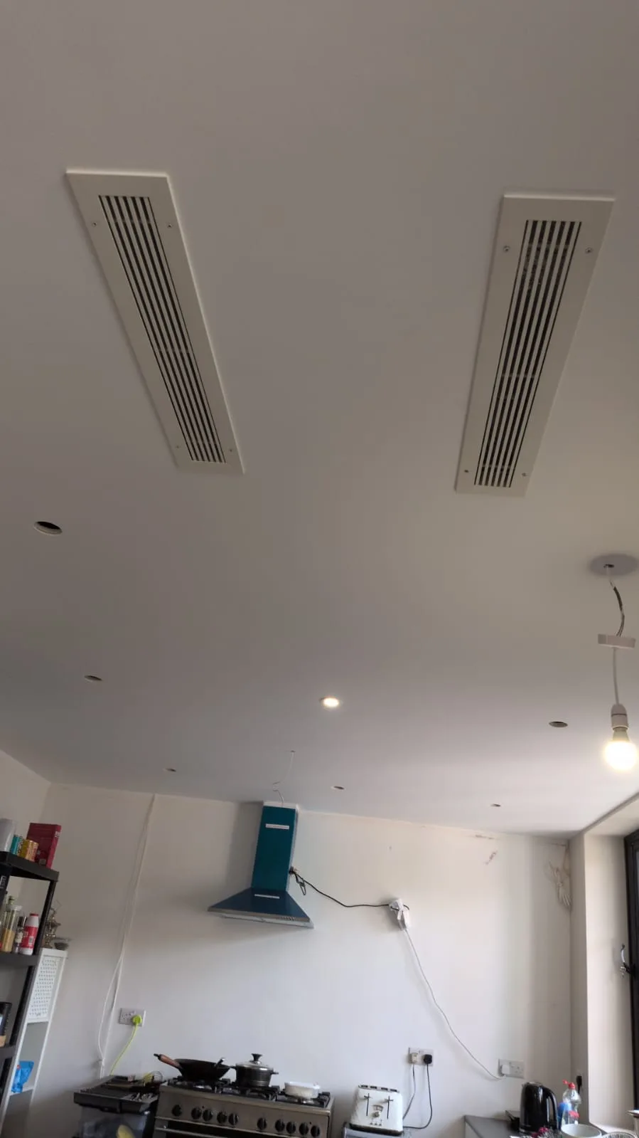 Concealed ducted air conditioning grilles installed in a kitchen extension ceiling